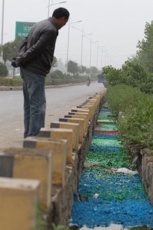 A Henan ditch is filled with millions of illegally dumped but colorful empty medicine capsules.