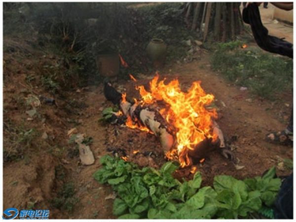 An elderly Chinese villager on fire in Hunan province.